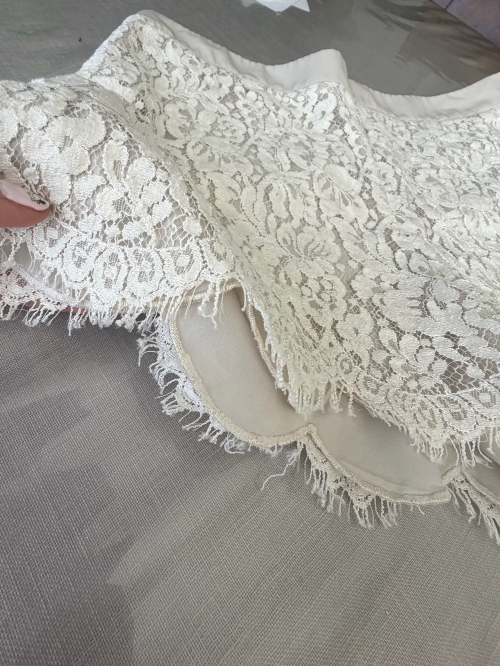 Club Monaco white lace shorts, featuring an elegant floral overlay pattern
